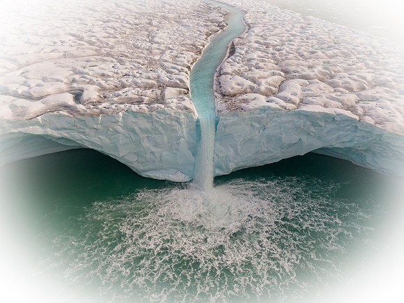 Waterfall off the Brasvelbreen glacier ice sheet